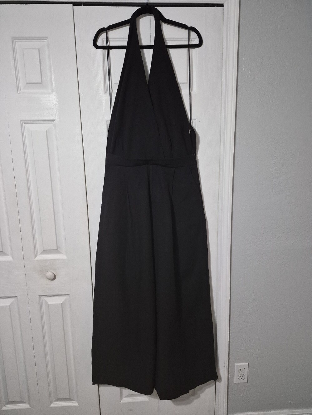 Chic black halter jumpsuit with wide-leg flowy pants!